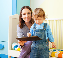 Image showing Mother with kid and tablet computer