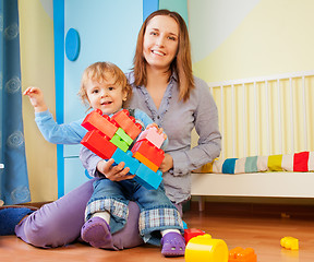 Image showing Playing with plastic blocks together