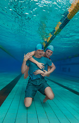 Image showing Girl hug boyfriend underwater
