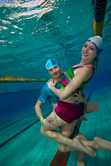 Image showing Couple having fun underwater in the pool