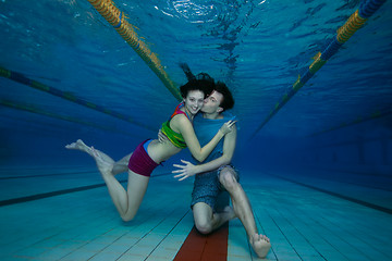 Image showing Fun and love underwater shoot of couple