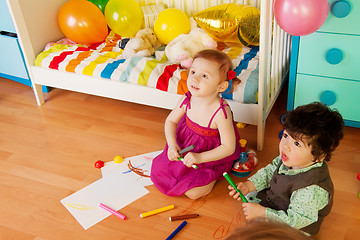 Image showing Kids drawing with crayons