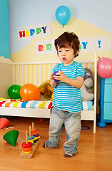 Image showing Asian kid playing with toys