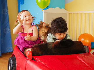 Image showing Kids with dog in the car