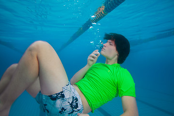 Image showing Blowing bubbles underwater