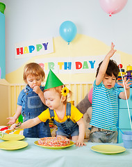 Image showing Three kids having fun on the birthday party