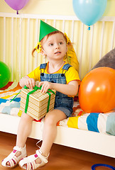 Image showing Little girl with present