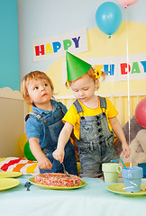 Image showing Two kids eating cake on the birthday party