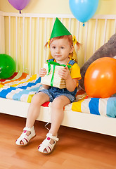 Image showing Happy little girl with present