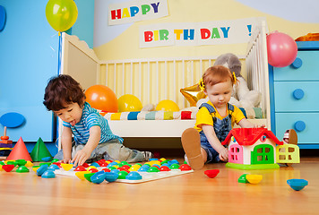 Image showing boy and girl playing with mosaic