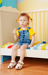 Image showing Little girl eat some snacks