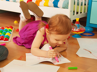 Image showing Beautiful girl drawing on the floor