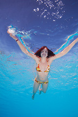 Image showing Happy young woman in the water