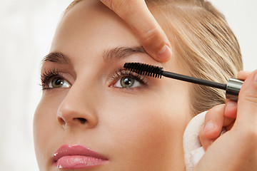 Image showing separating and curling lashes with mascara brush