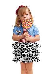 Image showing Small girl standing with lollipop