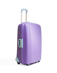 Image showing One big beautiful purple suitcases