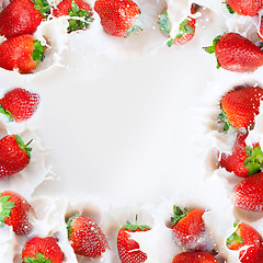 Image showing Strawberries splashing into milk frame