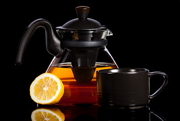 Image showing Tea in transparent glass pot with lemon