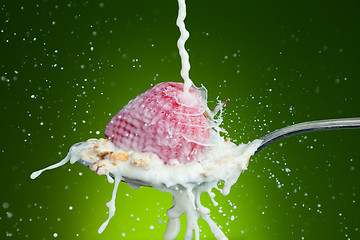 Image showing Spoon, milk, strawberry, splash