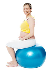 Image showing Pregnant woman sitting on gymnastic ball