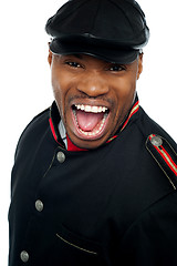 Image showing Shouting african man wearing cap