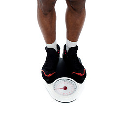 Image showing Man's feet on weighing scale