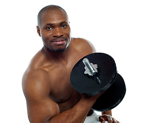 Image showing Powerful young man lifting weights