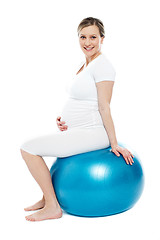 Image showing Pregnant lady sitting on exercise ball