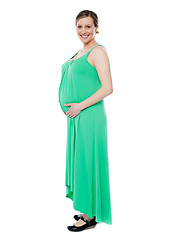 Image showing Pregnant woman posing in trendy fashion wear