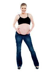 Image showing Pregnant woman wearing fashionable outfit