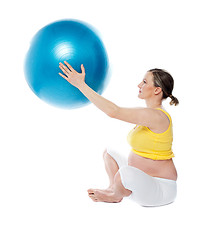 Image showing Attractive pregnant lady practicing yoga