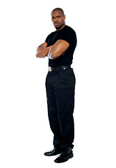 Image showing Male security guard with strong arms crossed