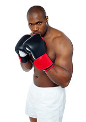 Image showing Shirtless african boxer aiming to punch you