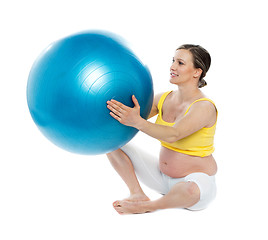 Image showing Pregnant woman excercises with a gymnastic ball