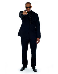 Image showing Businessman pointing at you. Full-length portrait