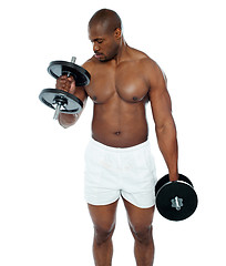 Image showing Young african man doing biceps exercise