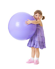 Image showing Little girl with a big purple ball