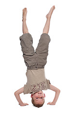 Image showing little boy standing on hands