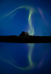 Image showing Northern Lights and reflection