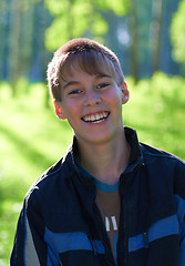 Image showing Smiling boy on a green background