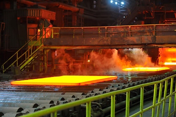 Image showing hot steel on conveyor 