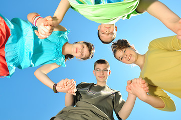 Image showing Four children against the sky