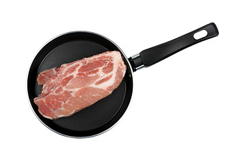 Image showing piece of raw meat in a frying pan