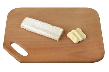 Image showing sliced ??brie cheese on a wooden cutting board