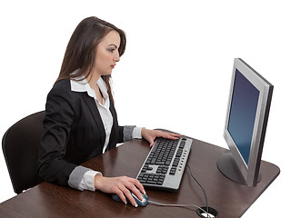 Image showing Young woman working on a computer