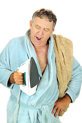 Image showing Yawning Man With Iron