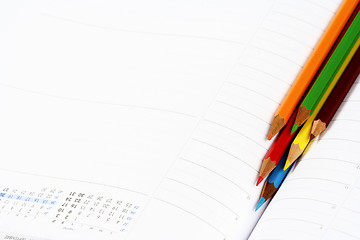 Image showing Color pencil and agenda