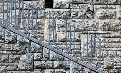 Image showing stone wall with blue railings