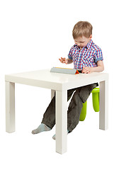 Image showing boy with a Tablet PC on the desk