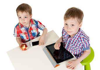 Image showing Two brothers with a Tablet PC